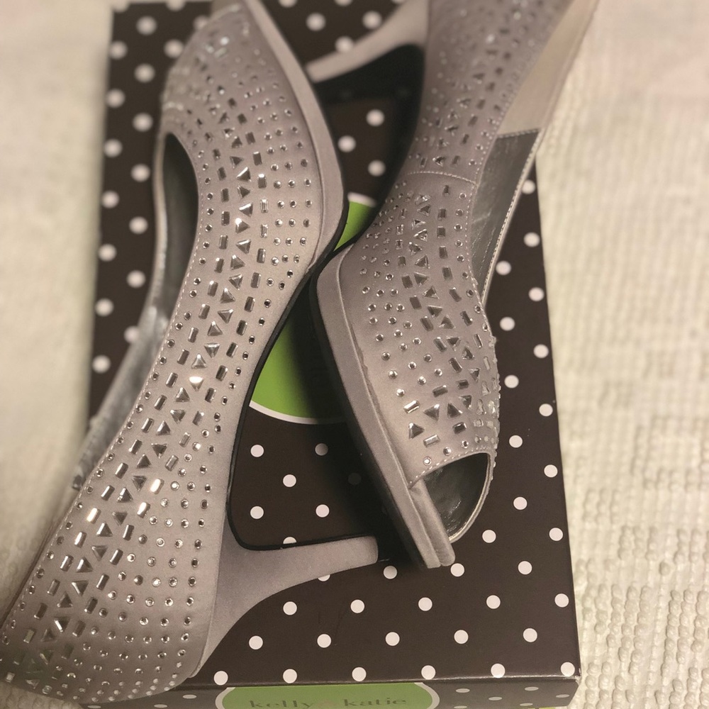 Silver open toed pumps